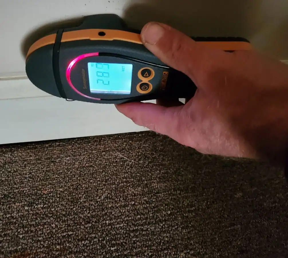 Moisture detection at baseboard during Storm Damage Restoration in Kerman